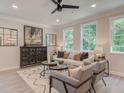 Bright and airy living room features a comfortable sofa and stylish coffee table at 4521 Twinberry Dr, Powder Springs, GA 30127