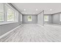 Spacious living room with recessed lighting and neutral gray flooring at 2216 Golden Dawn Sw Dr, Atlanta, GA 30311