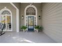 Elegant front entrance with a blue glass door and arched windows at 2727 Jamerson Rd, Marietta, GA 30066