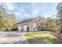 Two-car garage with a long driveway leading to the house at 2727 Jamerson Rd, Marietta, GA 30066