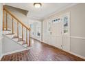 Brick floor entryway with wooden staircase and interior door at 2773 Townley Cir, Atlanta, GA 30340