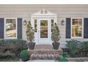 Inviting front entrance with white door, brick steps, and landscaping at 2773 Townley Cir, Atlanta, GA 30340