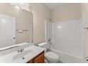 Full bathroom featuring a shower-tub combo and wood vanity at 498 Anglewood Trce, Stockbridge, GA 30281