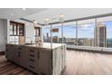 Open kitchen featuring a large island, modern lighting, and panoramic city views at 3630 Peachtree Ne Rd # 2207, Atlanta, GA 30326