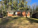 Brick ranch house with a large grassy yard at 2028 Wells Sw Dr, Atlanta, GA 30311