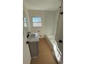 Updated bathroom with marble shower and modern vanity at 2662 Sweetwater St, Austell, GA 30106