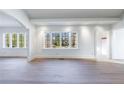 Spacious living room featuring hardwood floors and large windows at 2853 N Hills Ne Dr, Atlanta, GA 30305