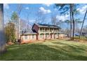 Two-story house with a spacious yard and mature trees at 1892 Mercedes Ne Ct, Atlanta, GA 30345