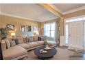 Comfortable living room with a plush sectional sofa, natural light, and neutral decor at 200 Claret Way, Mcdonough, GA 30252