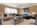 Cozy living room featuring a fireplace, comfortable seating, and a virtual staging design at 200 Claret Way, Mcdonough, GA 30252