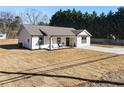 House with a spacious yard and a concrete driveway at 2605 Bobo Rd, Dallas, GA 30157