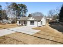 Newly built home with a modern farmhouse exterior and a large yard at 2605 Bobo Rd, Dallas, GA 30157