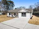 Charming one-story home with a white exterior and gray roof at 2605 Bobo Rd, Dallas, GA 30157