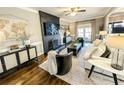 Living room with fireplace, hardwood floors, and ample natural light at 1160 Steeple Run, Lawrenceville, GA 30043