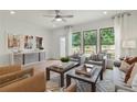 Inviting living room with natural light, stylish decor, and hardwood flooring, creating a cozy and welcoming space at 1084 Battery Park Rd, Decatur, GA 30033