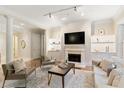 Elegant living room with fireplace, built-in shelving, and comfortable seating at 3280 Stillhouse Se Ln # 109, Atlanta, GA 30339