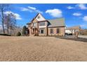 Spacious two-story home featuring brick facade, shutters, and well-maintained front lawn at 416 Telfair Way, Canton, GA 30115