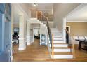 Inviting foyer with hardwood floors, staircase, and classic architectural details at 416 Telfair Way, Canton, GA 30115