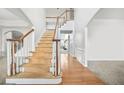 Elegant wooden staircase in a bright foyer at 4740 Eagles Ridge Loop, Stonecrest, GA 30038