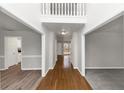 Bright and spacious entryway with hardwood floors and neutral paint at 730 Pinehurst Dr, Fairburn, GA 30213