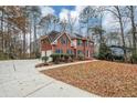 Two-story house with driveway, landscaping, and a large backyard at 730 Pinehurst Dr, Fairburn, GA 30213