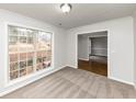 Home office with large window, neutral carpeting and hardwood floors at 730 Pinehurst Dr, Fairburn, GA 30213