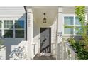 Gray front door with white columns and porch at 1267 Carbon Ct, Atlanta, GA 30316