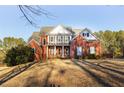 Beautiful two story brick home with a well-manicured front lawn at 116 Big Cotton Trl, Mcdonough, GA 30252