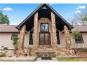 Front entrance with stone columns and double doors at 3355 Old Peachtree Rd, Dacula, GA 30019