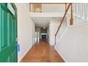 Inviting foyer with hardwood floors, high ceilings, and staircase at 485 Kensington Parc Dr, Avondale Estates, GA 30002