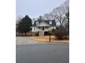 House exterior showcasing a two-story home with a front yard at 4045 Mark Todd Ct, Hoschton, GA 30548