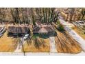 Ranch home's aerial view showing driveway and yard at 1801 Se Caribaea Se Trl, Atlanta, GA 30316