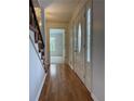 Bright entryway with hardwood floors, featuring a view to the living room at 620 Oakstone Way, Roswell, GA 30075