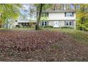 Charming two-story brick home with a well-manicured front yard at 620 Oakstone Way, Roswell, GA 30075