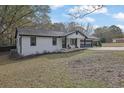 Newly remodeled home with white siding and a spacious yard at 97 Grayson New Hope Rd, Grayson, GA 30017