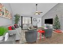 Cozy living room with gray walls, vaulted ceilings, fireplace, modern furnishings, and natural light at 97 Grayson New Hope Rd, Grayson, GA 30017