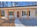Front view of charming house with covered porch at 1337 Fairfield Dr, Lilburn, GA 30047