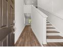 Bright entryway with hardwood floors and staircase at 2448 Lenox Se Rd, Conyers, GA 30094