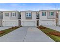 Beautifully designed townhomes feature painted brick, individual driveways, and well maintained landscaping at 223 Sanctuary Dr, Mcdonough, GA 30253