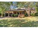 Charming stone house with a two-car garage and manicured lawn at 1452 Merriman Ne Ln, Atlanta, GA 30324