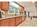 Well-appointed kitchen with granite countertops, wooden cabinets, and stainless steel appliances at 1195 Fielding Way, Marietta, GA 30068