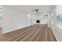 Spacious living room featuring hardwood floors and fireplace at 1573 Deerwood Ln, Acworth, GA 30102