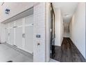 Inviting entryway with hardwood floors, access to garage, and staircase at 250 Lytham Se Dr, Mableton, GA 30126