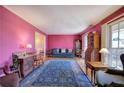 Spacious living room with pink walls, hardwood floors, and antique furniture at 731 Willow Ridge Dr, Marietta, GA 30068