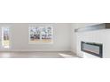 Cozy living room with an electric fireplace and a white shiplap surround for a modern touch at 4311 Portsbrook Ave, Snellville, GA 30039
