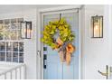 Light blue front door with a magnolia wreath at 1260 Amanda Cir, Decatur, GA 30033