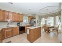 Spacious kitchen with island, wood cabinets, and eat-in area at 340 Shyrewood Dr, Lawrenceville, GA 30043