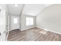 Spacious living room featuring hardwood floors and lots of natural light at 1162 Misty Meadows Xing, Hampton, GA 30228