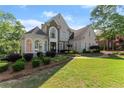 Two-story home with lush front yard and manicured landscaping at 2960 Millwater Xing, Dacula, GA 30019