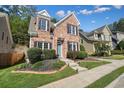 Charming brick home with manicured lawn, black shutters, and a welcoming entrance at 3606 High Battery Nw Blf, Acworth, GA 30101